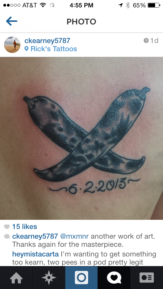 Crossed pencils tattoo